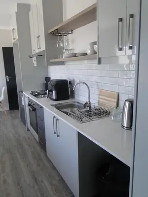 a kitchen with a sink and a counter top at Fresh Air in Cape Town