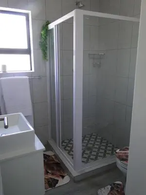 a bathroom with a shower and a sink at Fresh Air in Cape Town