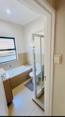a bathroom with a tub and a toilet and a sink at Your Perfect Little Cozy Getaway in Cape Town