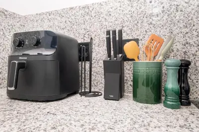 a toaster and other kitchen utensils on a counter at 116 Paarl - Lux 1 Bedroom Apt with AC and Parking in Paarl