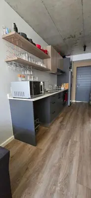 a kitchen with a sink and a counter top at Ebbies place in Cape Town