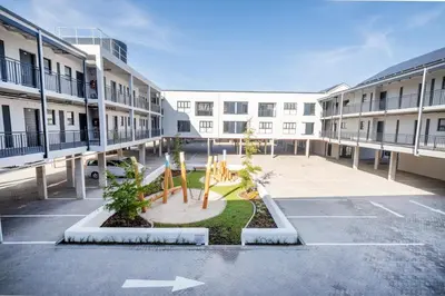 an empty parking lot in front of a building at 216 Paarl Lux 1 Bdrm Apt with Parking and AC in Paarl