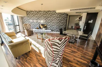 a living room with a zebra print wall at Colosseum Hotel in Cape Town
