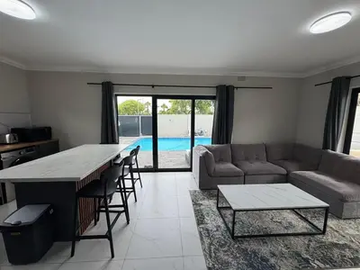 a living room with a couch and a table at Lansdowne Lodge in Welton