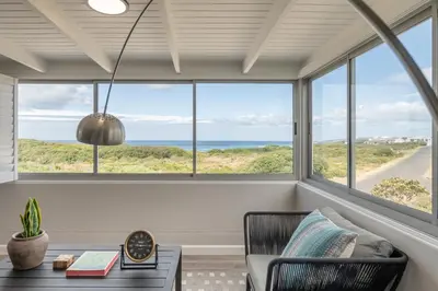 a living room with a view of the ocean at Coats Haven in Hermanus