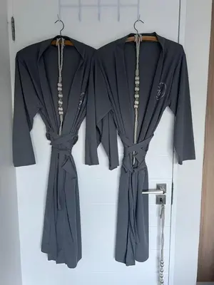 a black robe is hanging on a door at The Jade, Somerset West in Strand