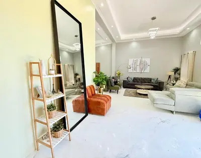 a living room with a mirror and a couch at Centrally located 11 sleeper house near Canal Walk in Cape Town