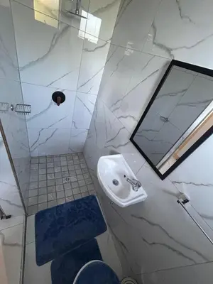 a bathroom with a sink and a mirror at New Dawn Guest House in Goodwood