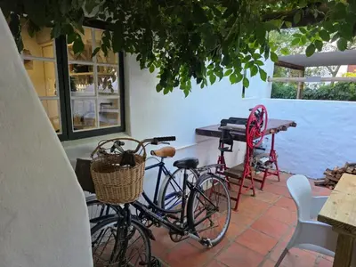 a couple of bikes parked next to a table at Maggie Rose Self Catering Cottage in Greyton