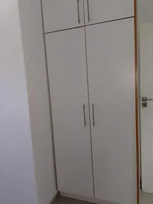 a pair of white cabinets in a room at Edion Royal Guesthouse in Cape Town