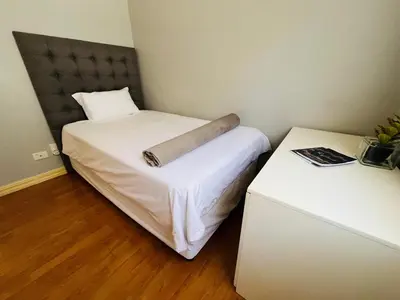 a small bedroom with a bed with a pillow on it at 4 Bedroom Bliss in Cape Town