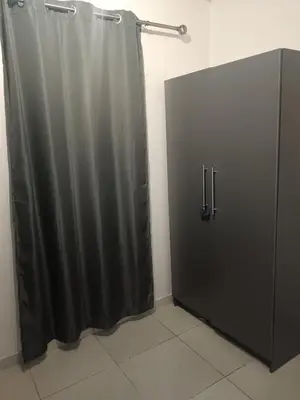 a bathroom with a shower curtain and a door at Belhar Lofts in Belhar