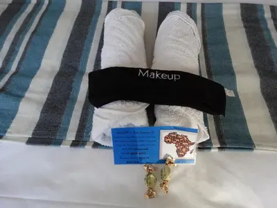 a pair of white socks and a pair of earrings at African Oasis Cameroon in Somerset West