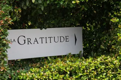 a sign on a hedge with the word gratitude at Avemore Lagratitude no6 - with full backup power in Stellenbosch