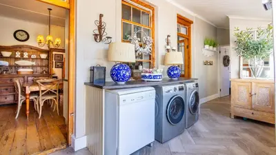 a laundry room with a washer and dryer at 59 Marine Hermanus in Hermanus