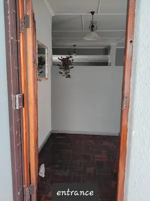 an open door to a room with a hallway at strand Holiday House in Strand
