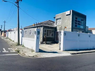 a building on the side of a street at Prince Adina Guesthouse in Tiervlei
