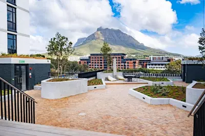a view of a city with a mountain in the background at 311 Riverlands - Lux 2 Bedroom Apartment in Cape Town
