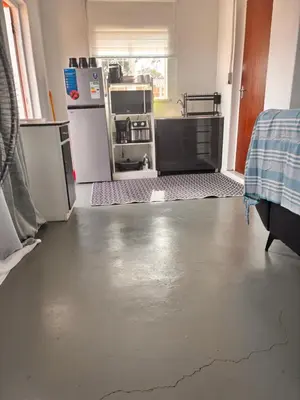 a kitchen with a floor that has a crack in it at Cape Comfy Hidden Home in Cravenby