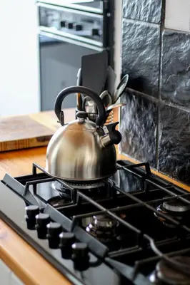 a tea kettle sitting on top of a stove at Palm La Vie in Worcester