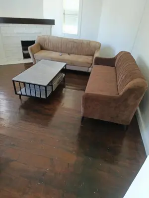 a living room with a couch and a coffee table at MAREE LODGe GUEST HOUSE BELLEVILLE in Bellville