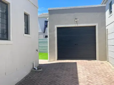 a garage door in the side of a house at Valley Escape in Cape Town