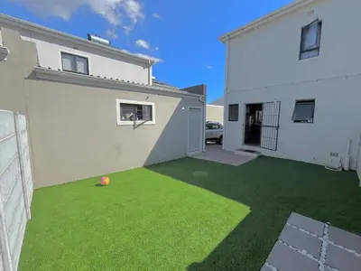 a yard with a soccer ball on the grass at Valley Escape in Cape Town