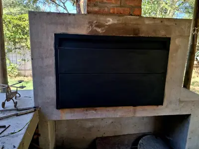 a tv sitting on top of a brick wall at Pennywhistle in Eersterivier