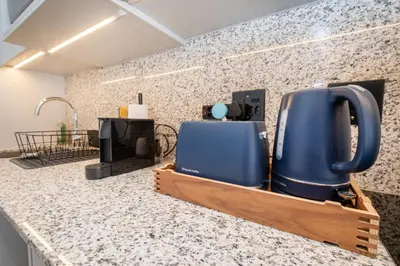 a kitchen counter with a blue appliance on it at 232 Paarl Studio With AC and Onsite Parking in Paarl