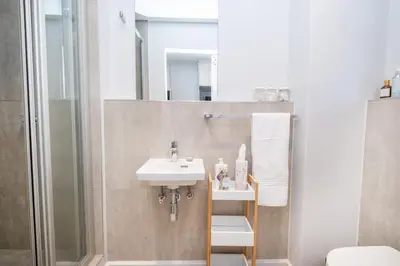 a bathroom with a sink and a shower at 232 Paarl Studio With AC and Onsite Parking in Paarl