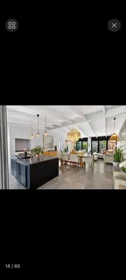 a living room with a kitchen and a dining room at Beach House Living in Gordonʼs Bay