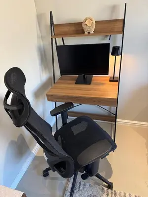 a computer chair sitting next to a desk with a computer monitor at Montbleu 3 Bed 3 Bath House in residential security Estate in Stellenbosch