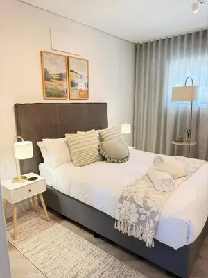 a bedroom with a large bed in a room at Platform 123 - 2 On Tabak with onsite Parking in Paarl