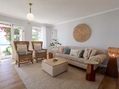 a living room with a couch and two chairs at Salt & Butter in Hermanus