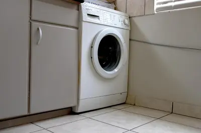 a white washer and dryer in a laundry room at Bona Vista in Pringle Bay