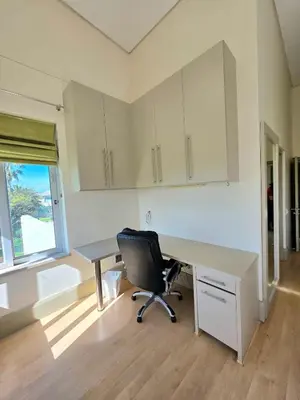 an empty office with a desk and a chair at Beachfront Golf Estate Escape in Strand in Strand