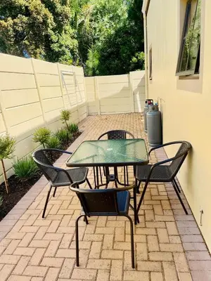 a patio with a table and four chairs at The Hidden Gem in Oakdale