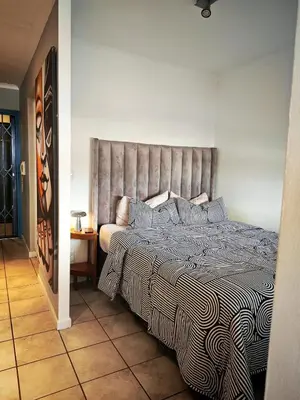 a bedroom with a large bed in a room at Comfy 1 Bedroom Flat in Thornton