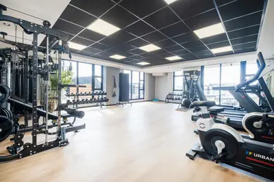 a gym with treadmills ellipticals and tread machines at 622 Riverlands - Lux 2 Bedroom Apartment in Cape Town