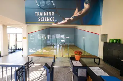 a room with two tables and a sign that reads training science at #AlimamaSpaces The Manson's Fynbos in Cape Town