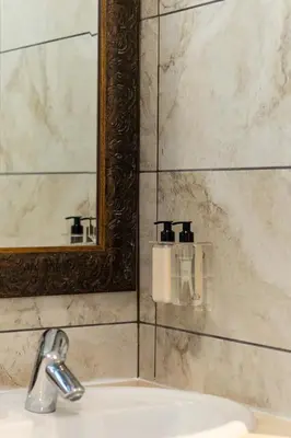 a bathroom with a sink and a mirror and a sink at Avemore Eikehoff no 2 in Stellenbosch