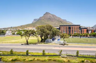 a view of a city with a mountain in the background at 312 Riverlands - Lux 2 bedroom Apartment in Cape Town