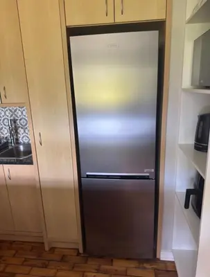 a stainless steel refrigerator in a kitchen at The Botanic Venus in Paarl