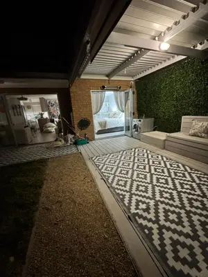 a room with a bedroom with a bed and a couch at 3at33 CT in Cape Town