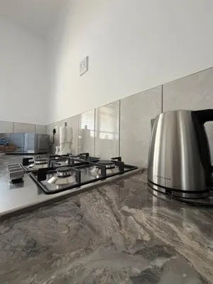 a kitchen with a stove and a toaster at Plattekloof Mountain view in Plattekloof
