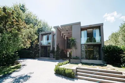 a house with a staircase in front of it at Amour in Pniel