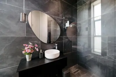 a bathroom with a sink and a mirror at Amour in Pniel