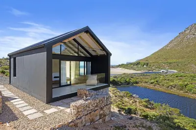 a small house on the side of a mountain at Nowhere Els in Rooiels