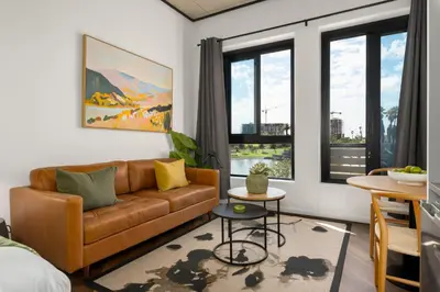 a living room with a couch and a table at Bridgewater One 206 in Cape Town