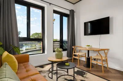 a living room with a couch and a table at Bridgewater One 206 in Cape Town